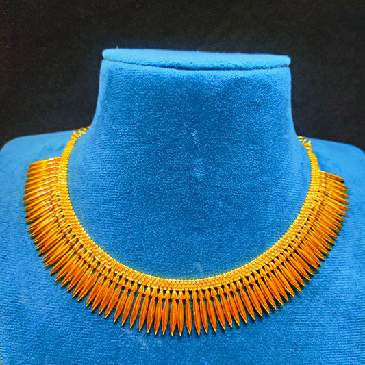 Gold Plated Mulla Mottu necklace on a blue velvet mannequin against a black background