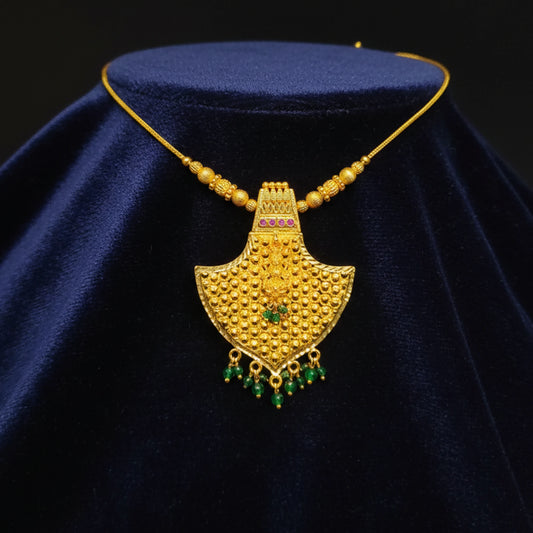 Traditional gold plated temple jewelry with pendant and lakshmi motif