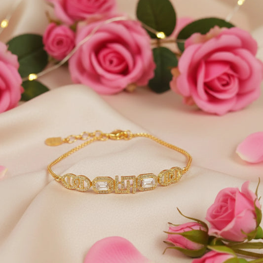 Gold plated bracelet on a pink surface with pink roses
