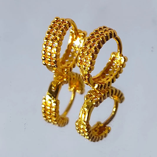 Pair of gold plated second stud hoop earrings on a light gray background