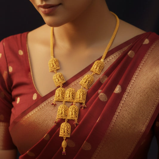 Woman wearing a red saree with gold plated Vrindavan Heritage Radha Krishna Necklace.