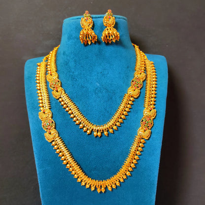 Antique gold plated temple jewelry set featuring a long haram necklace, a matching short choker necklace, and bell-shaped jhumka earrings with traditional South Indian spiked golden bead and floral design