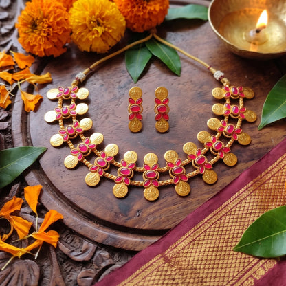 Traditional South Indian matte gold Kasu Mala coin choker necklace with ruby stone accents and matching stud earrings,