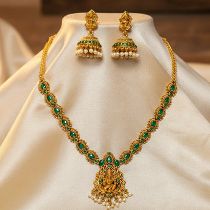 antique gold finish lakshmi pendant necklace with green stones