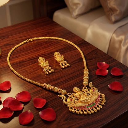 Antique Gold Finish necklace and earrings set on a wooden surface with red rose petals