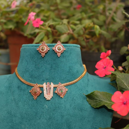 Jewelry set on a green mannequin with flowers in the background