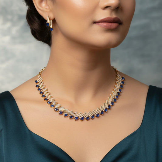Woman wearing a gold plated White and blue necklace with a blurred background