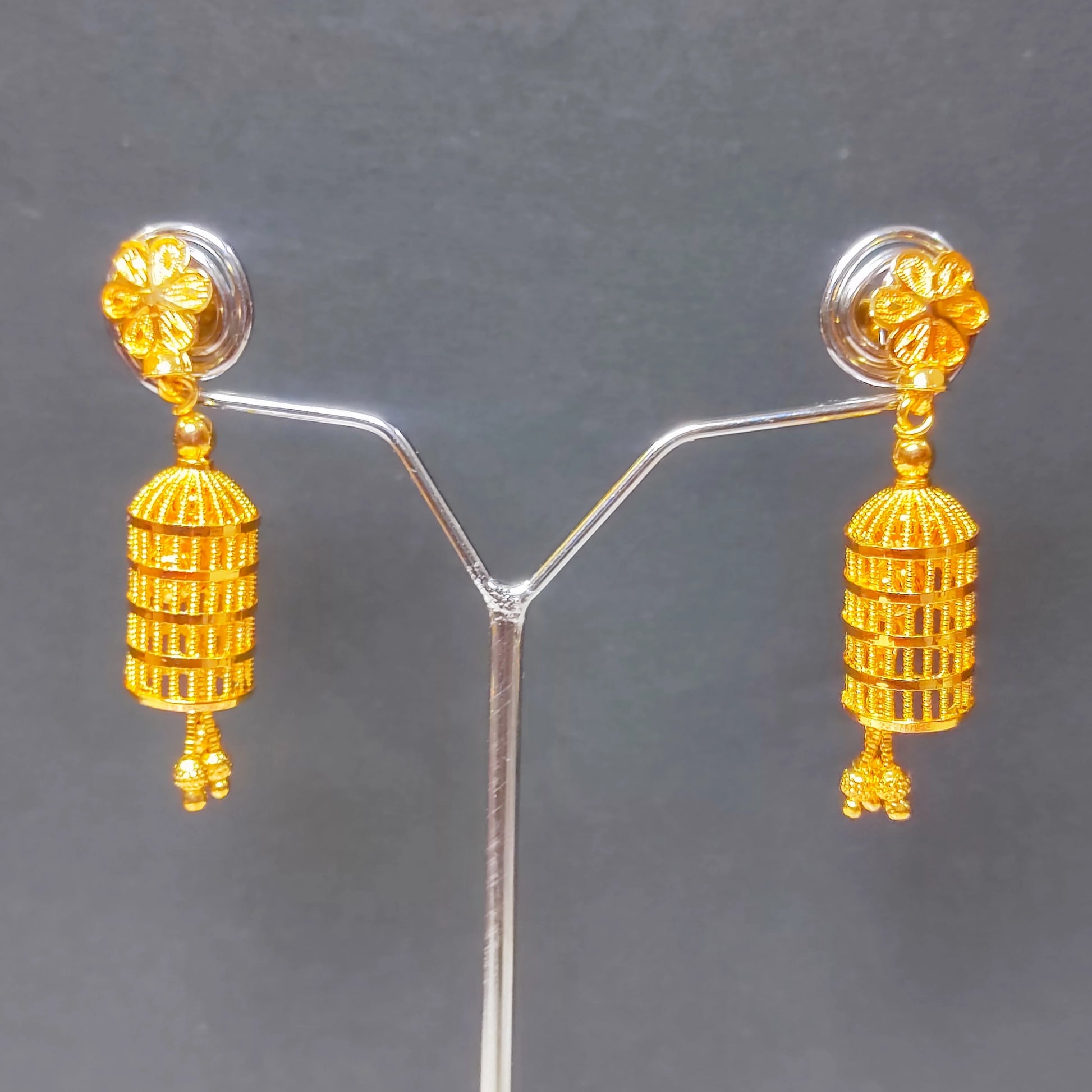 Gold plated Lantern style Jimikki/Jhumka earrings on a gray background