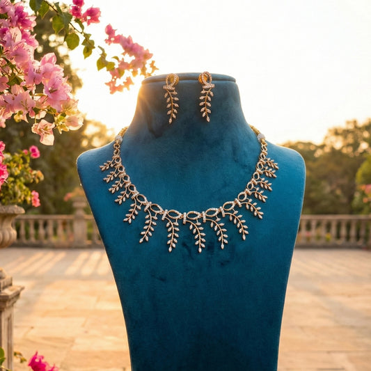 Necklace set on a blue mannequin with flowers in the background