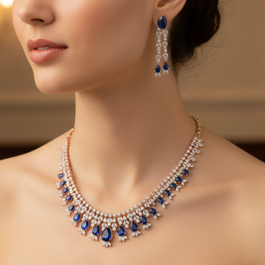 Close-up of a woman wearing a Rose Gold blue and white gemstone necklace and earrings.