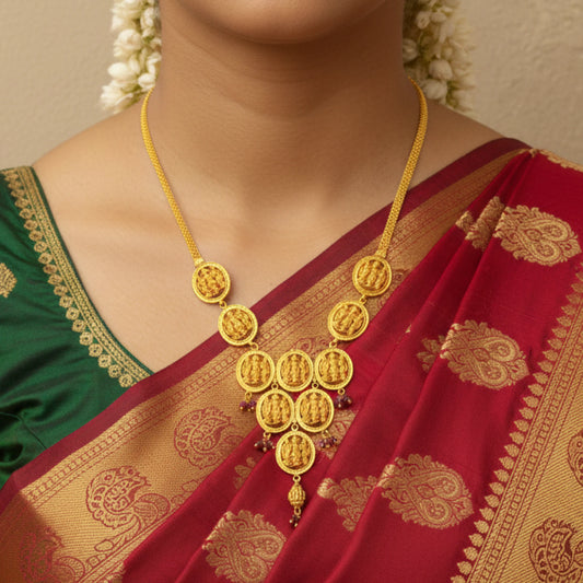 Gold Plated Ayodhya Heritage Ram Parivar necklace on a person wearing a red and green saree with gold patterns.