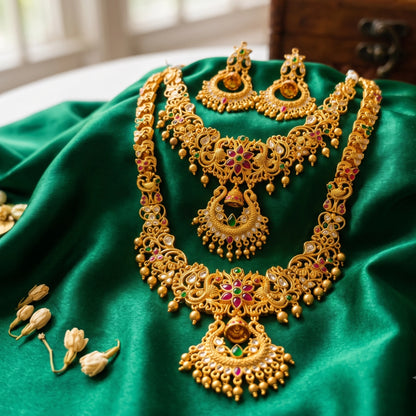 A rare collector's bridal set featuring an exquisite, intricately carved Chandbali (crescent) motif rarely seen in traditional South Indian matte temple jewelry layout configurations. Comes with a long haram, a short haram or choker and complimented with a chandbali earrings set