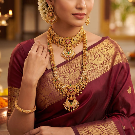 A rare collector's bridal set featuring an exquisite, intricately carved Chandbali (crescent) motif rarely seen in traditional South Indian matte temple jewelry layout configurations. Comes with a long haram, a short haram or choker and complimented with a chandbali earrings set