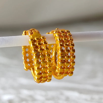 Gold plated second stud hoop earrings on a white background