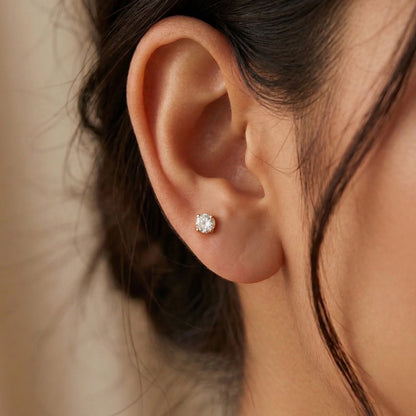 Close-up of an ear wearing a second stud earring with a blurred background
