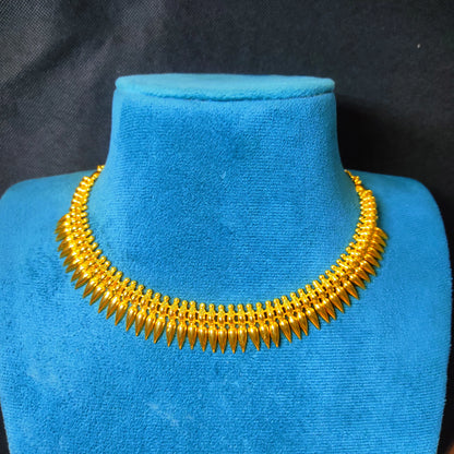 Gold plated Mulla Mottu Short necklace on a blue mannequin against a black background